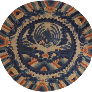 Round rug with a detailed central blue mythological creature pattern on a beige ground, accented with rust and green.