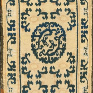Beige rug with blue floral patterns
