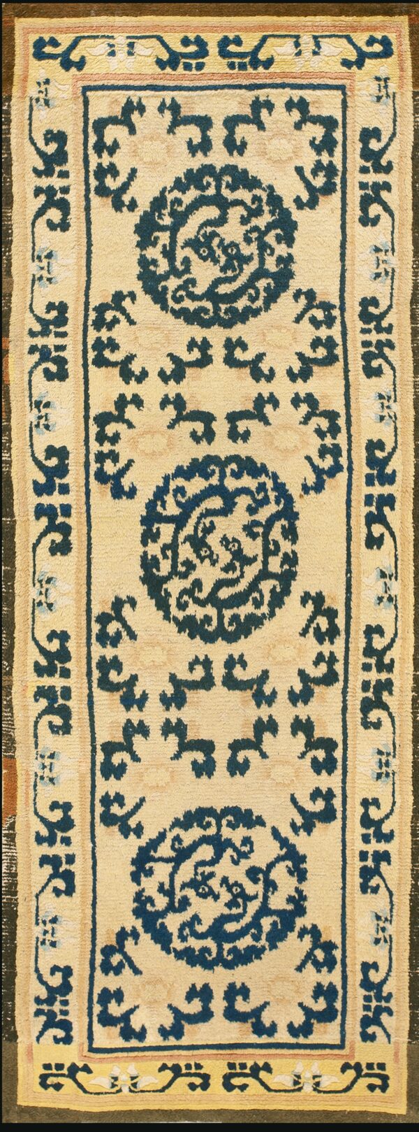 Beige rug with blue floral patterns