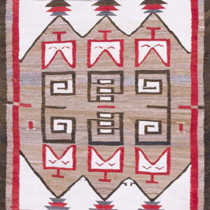 Geometric flatweave rug in white, red, tan, and brown with stacked motifs and spiral patterns.