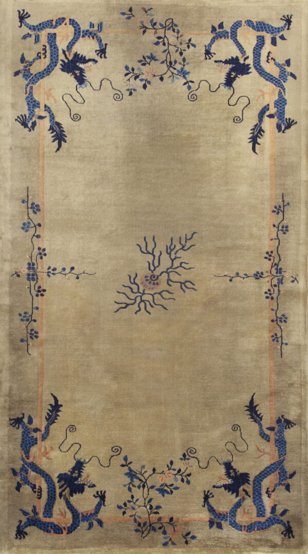 A low-pile taupe rug features stylized blue dragons and peach botanical borders.