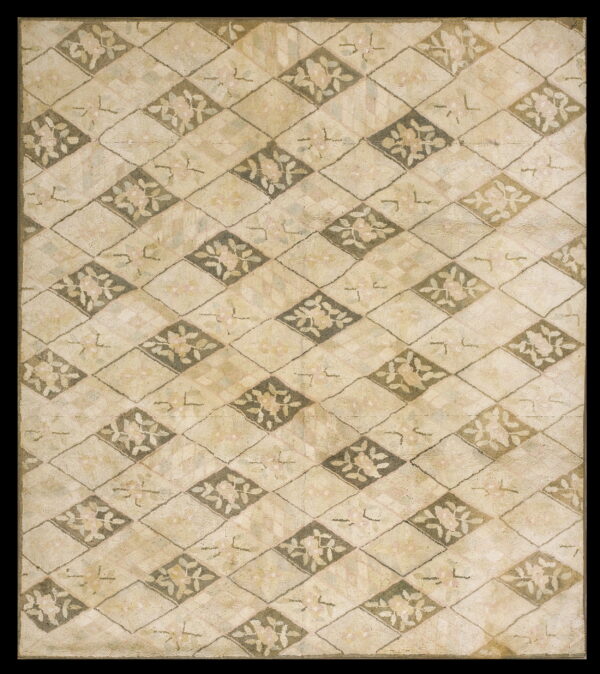 Muted beige textured rug featuring a floral diamond lattice pattern in cream, light pink, and sage green.