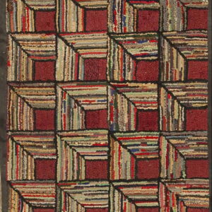 Textured maroon and multicolored runner with a repeating geometric block pattern.