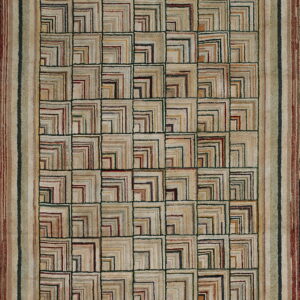 Earthy rug featuring a geometric patchwork grid of concentric L-shapes bordered by vertical stripes.