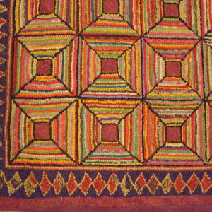 Highly textured, multicolored hooked rug with a geometric pattern of concentric squares and a purple diamond border.