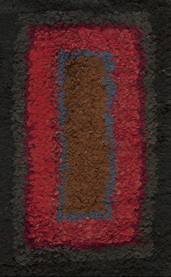 High-texture rug with concentric vertical blocks of brown, blue, red, and dark charcoal black.