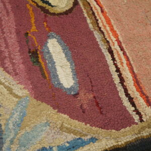 Chunky looped texture detail showing abstract shapes in maroon, pink, blue, cream, and tan colors.