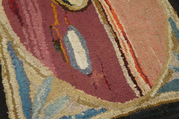 Chunky looped texture detail showing abstract shapes in maroon, pink, blue, cream, and tan colors.