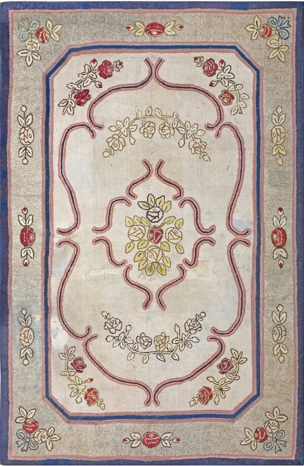 Light beige rug with a gray border, featuring a detailed floral design in red, pink, and blue.