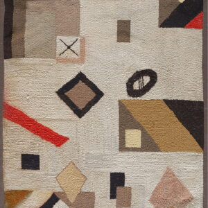 A textured low-pile rug with an abstract geometric pattern in beige, brown, black, mustard, and red accents.
