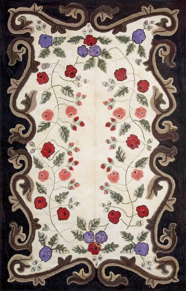 Cream rug with red and purple floral pattern and a bold, dark brown scrolled border.