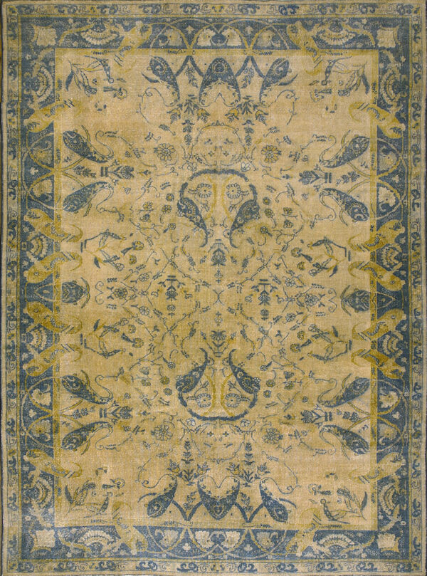 A distressed gold and teal blue rug with a traditional repeating paisley motif and wide border.