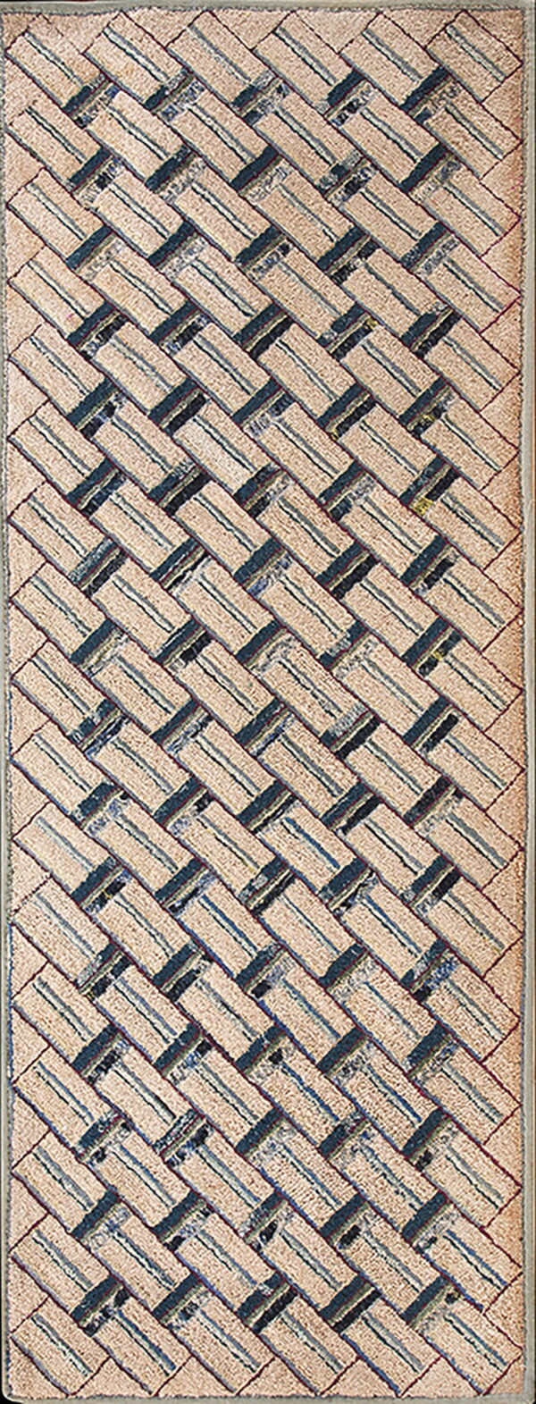 Textured runner rug featuring a beige and dark blue striped herringbone pattern.