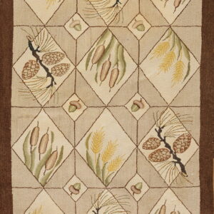 Beige and brown rug with a diamond lattice pattern featuring pine cones, cattails, and wheat motifs.