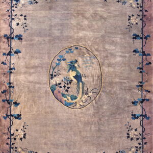 Muted lavender rug featuring a central oval medallion with a colorful bird and intricate blue floral border.