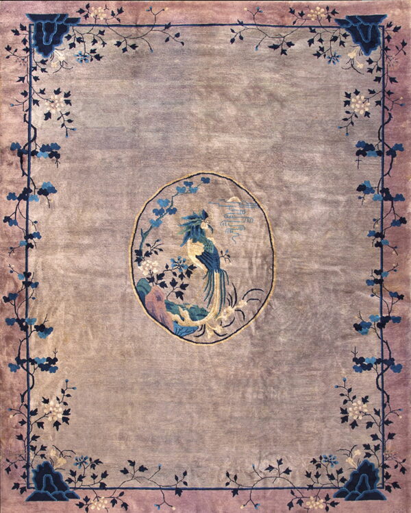 Muted lavender rug featuring a central oval medallion with a colorful bird and intricate blue floral border.