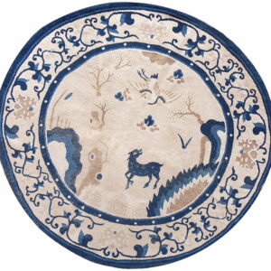 Circular rug in beige, deep blue, and tan with a stylized scenic pattern and ornate floral borders.