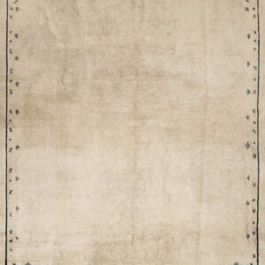 Distressed beige rug with a dark blue pictorial border and ornate corner designs.
