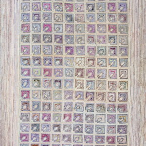 Textured cream rug with a repeating grid of abstract squares in muted blues, purples, and pinks.