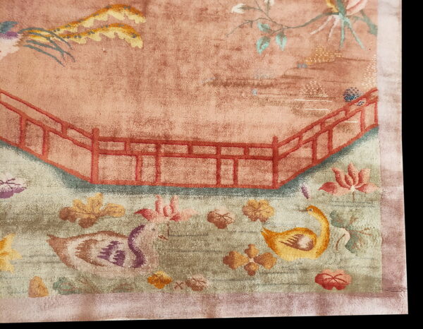 Red knotted antique 1920s room size wool rectangle chinese - art deco rug 2 Faded pink and green rug detail with a red railing, stylized birds, and floral garden patterns.