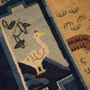 A detailed rug section shows a stylized white goose on a blue field next to tan stylized patterns.