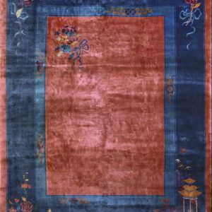 High-sheen rug featuring a russet field bordered in deep blue with intricate floral and pavilion designs.
