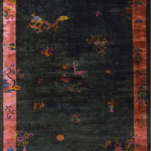 Dark rug with a red-orange border featuring dragons, deer, birds, and detailed floral motifs.