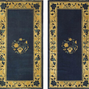 Blue rug with floral border design