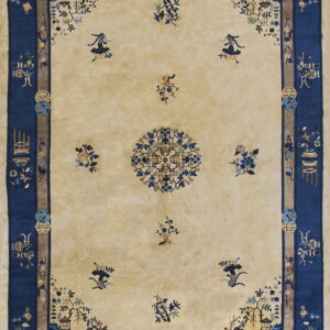 Beige high-pile rug with dark blue borders and scattered traditional floral and medallion patterns.