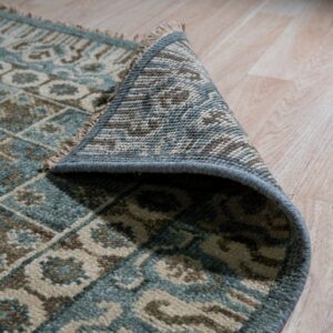 Decorative rug partially rolled up