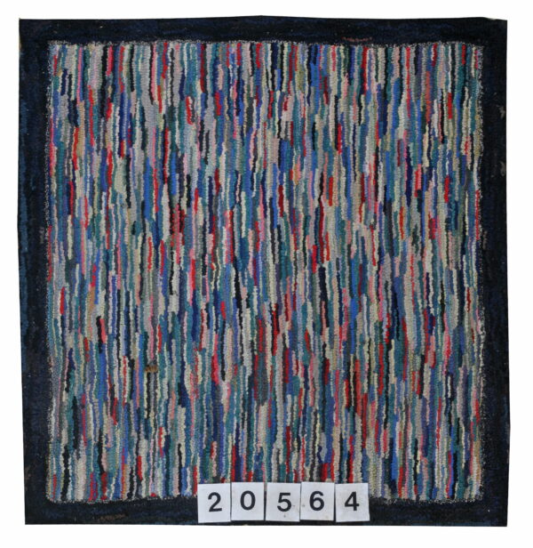 Multicolored vertical stripe rug with a high hooked texture and a thick, solid navy blue border.