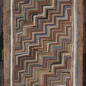 Highly textured runner rug with a diagonal zigzag pattern in mixed brown, blue, and tan shades.