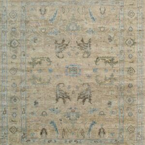 Low-pile traditional area rug in textured beige with blue, brown, and green stylized geometric patterns.