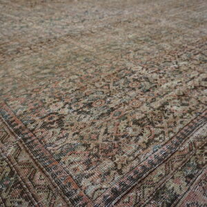 Intricate patterns on vintage Persian rug.
