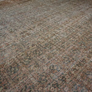 Faded intricate floral Persian rug