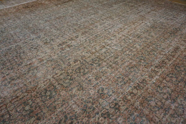 Faded intricate floral persian rug