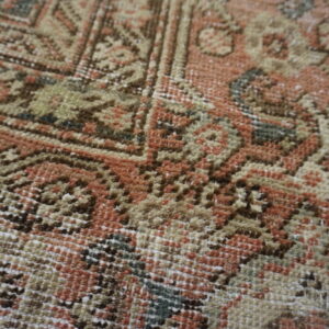 Intricate floral pattern on vintage rug