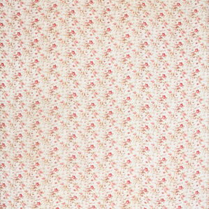 Cream rug with a dense pink and red floral pattern and a distinct overall quilted texture.