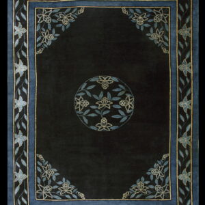 Plush, dark-field rug featuring blue borders and stylized light blue floral designs with a central motif.