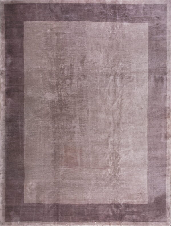 A mauve rectangular rug featuring a broad central field surrounded by darker, contrasting border bands.
