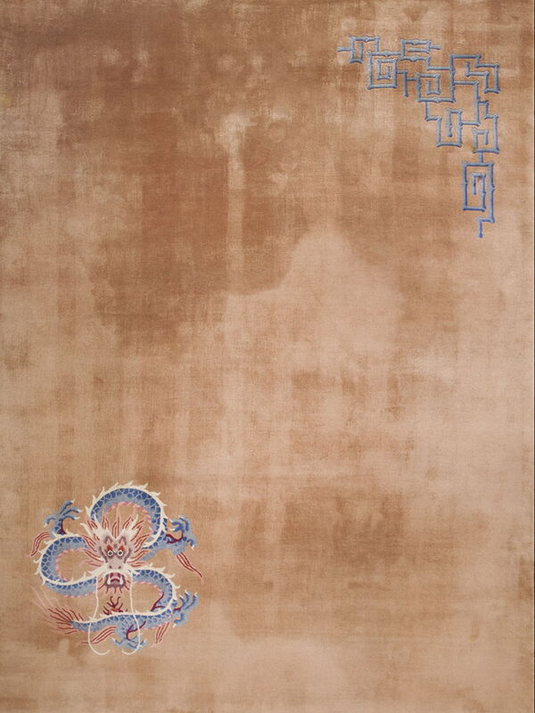 Taupe low pile rug featuring a detailed blue dragon and geometric fretwork designs in opposing corners.