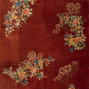 Low-pile reddish-brown rug featuring asymmetric, multicolor bouquets of detailed flowers and leaves.