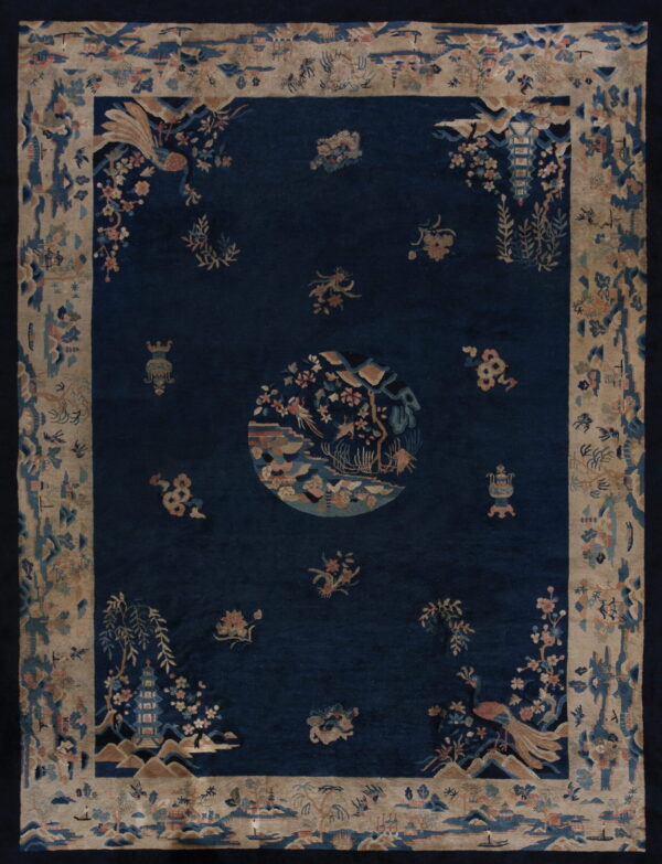 Deep blue rug with a central medallion and florals, framed by an intricate beige landscape border.