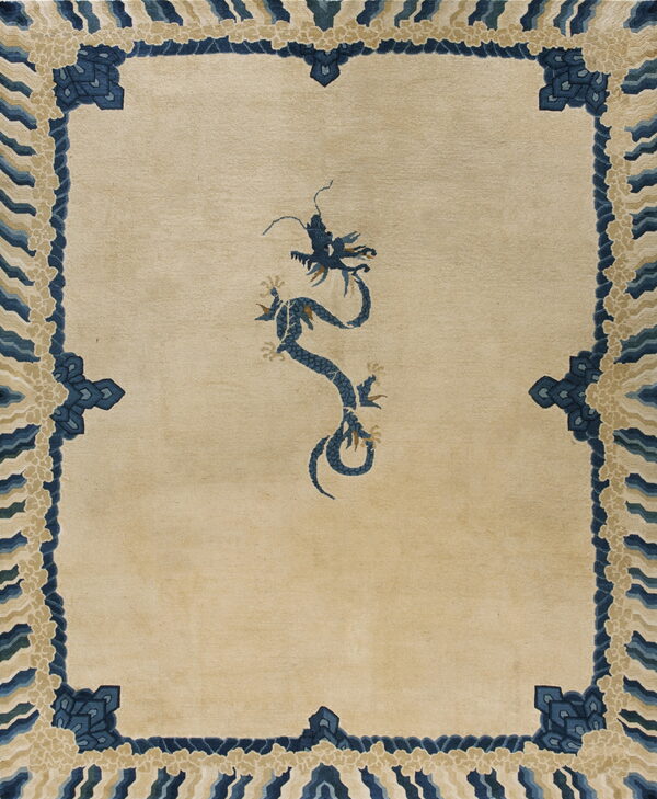 Beige low-pile rug with a detailed blue dragon pattern and blue and cream wave borders.