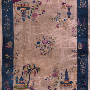 Shiny taupe rug with a navy border and detailed multicolored Chinoiserie landscape motifs.