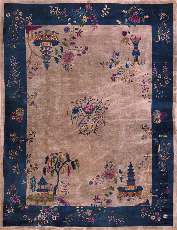 Shiny taupe rug with a navy border and detailed multicolored chinoiserie landscape motifs.