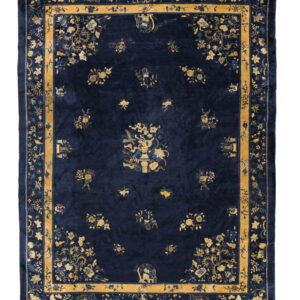 Dark blue rug featuring complex yellow-gold floral and vase motifs within multiple decorative borders.
