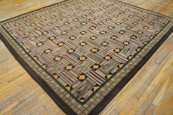 Diagonal striped low-pile rug with yellow accents and a square border, displayed on hardwood flooring.
