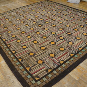 Textured rug with a striped basketweave pattern, yellow accents, and a checked border on distressed wood floor.