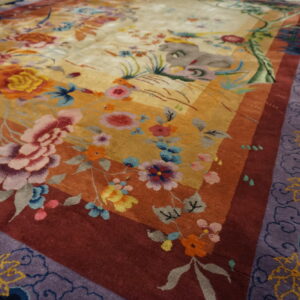 High-pile rug with colorful floral motifs, banded borders, and a purple cloud pattern on wood.